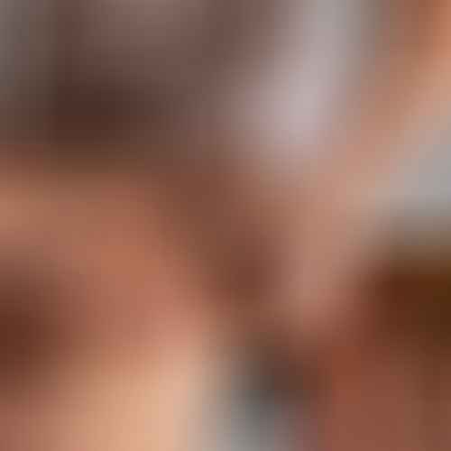 woman-getting-back-massage-from-female-masseur